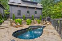 Custom rock wall with stones from property incorporated in design. Heated/ cooled