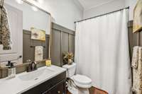 Full guest bath on main floor next to office