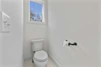 Private Water Closet – Convenient separate toilet area with natural light.
