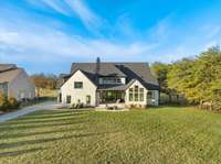 Privately tucked in the corner of the neighborhood with large mature tree line