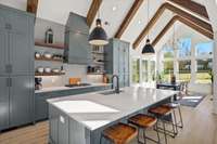 Gas cook top. Large counter height quartz island. Designer finishes.