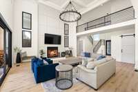 A better view of the gorgeous fireplace with tasteful wood detail from floor to ceiling in muted two-tone that is subtle and sleek.
