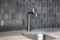 Custom tile and designer faucet
