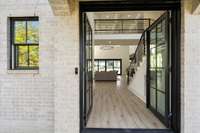 Double glass doors into a welcoming 2 story foyer