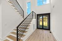 Light, bright foyer and front staircase