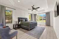 Primary suite is downstairs overlooking your backyard oasis