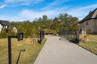 Secure private entrance to your back yard. Neighbors are also putting a tree buffer along this driveway, as well, for even MORE privacy!