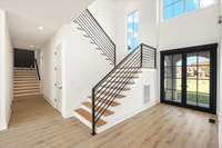 Two stairways. One back way to the Bonus and bedrooms