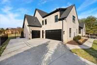 Double garage, carriage garage, and pedestrian door.  Perfect for your cars, golf cart, or fun toys like your four wheeler or sports car!