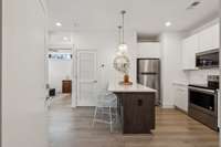 Bright kitchen with island for extra seating.