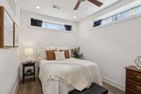 Lovely bedroom with transom windows for additional light.