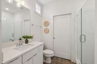 Ceramic tile bathroom with walk in shower.