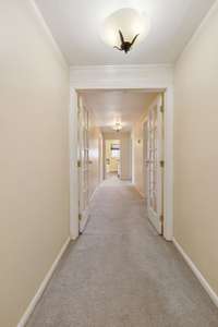 Short flight of stairs and french doors lead to the upstairs floor