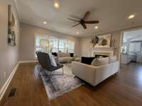 Spacious living room with natural sunlight coming through!