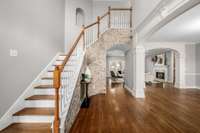 Beautiful foyer with slivered brick accents.
