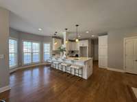 White kitchen cabinets with white quartz counter-tops