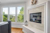 Primary owner suite fireplace with stunning views.