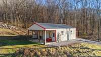 24'x30' garage/workshop with a 10' patio to hang a swing from