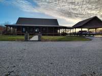 Back of Home with covered car port
