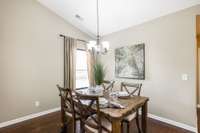 The dining space is exceptionally large, offering flexibility to accommodate any shape table with plenty of room to add a hutch or buffet for extra storage or display.