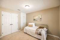 To the right you'll find the guest room tucked away at the front of the home. There is a nice sized closet along with added built ins!