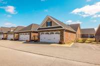 This home offers 2 bedrooms, 2 bathrooms, and a spacious 2-car garage, with additional guest parking just steps away.