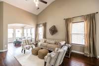 The living room is a true highlight, featuring high ceilings and extra windows, which fill the space with natural light—enhanced by this home’s desirable end-unit location.