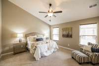 The primary suite is a private retreat, thoughtfully tucked away at the back of the home for ultimate peace and quiet.