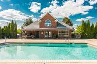 When it’s time to unwind, the beautiful outdoor pool provides a refreshing escape, complete with plenty of seating for sun or shade, including tables and chairs for lounging or gathering with friends.