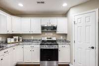 The gas stove is a wonderful, upgraded addition to this space and the pantry is very spacious.