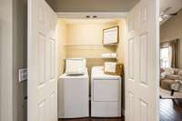 The laundry room has additional storage.