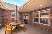 The charming gated courtyard is a welcoming entryway, offering a private outdoor space perfect for potted plants, flowers, or a cozy seating area.
