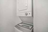 The stackable washer and dryer maximize space while adding a streamlined look to the area.