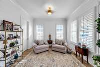 Look at this copper sun motif luminiere!  This room which could serve as an office with a walk in closet for plenty of storage.