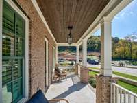 Front porch overlooks a developing green space and 2 ponds which adds to the quiet street