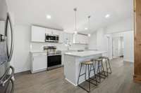 Granite Countertops with Island and New Appliances