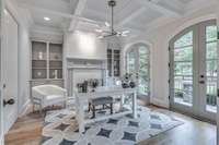 Off the foyer is this spacious office or formal living room.  The fireplace adds a gorgeous touch with the new marble surround!  As an added bonus, there are 2 sets of doors that open to the front porch.