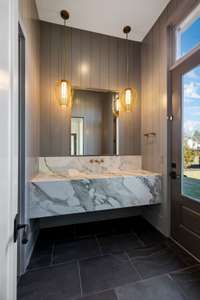 1 of 2 powder baths on first floor - door to exterior used as pool bath