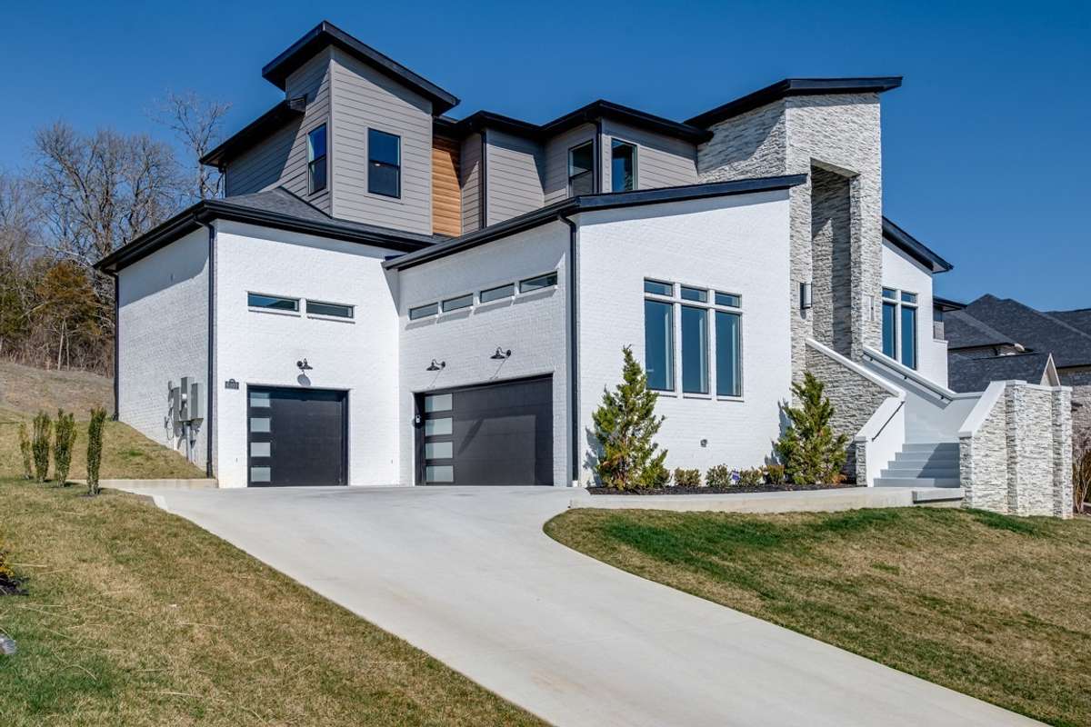 Magnificent modern thoughtful open concept design high end finishes Thermador appliances; granite waterfall island; 3 fireplaces; Chef's kitchen; ; 20 ft ceilings; hardwood floor; throughout;  spa like bath super size shower built in grill/fireplace