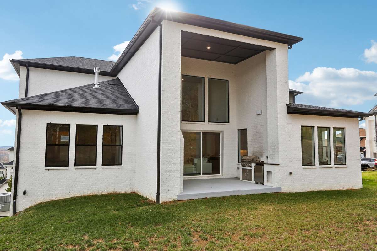 Back view of this top tier PIB modern custom home