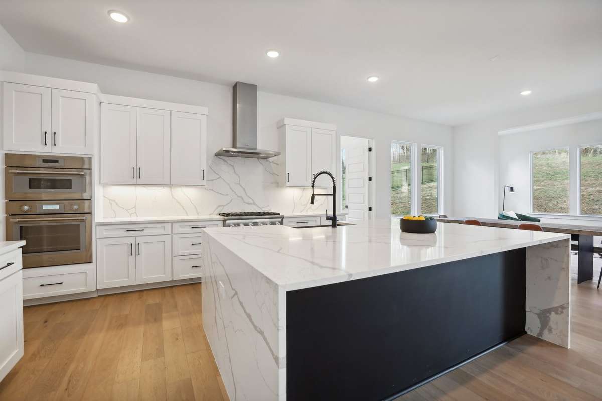 High end finishes throughout!  Gourmet chef's kitchen with Thermador appliances; designer granite waterfall island; auto faucet' gas cooktop full freezer/ frig; smoothie station; high end cabinetry