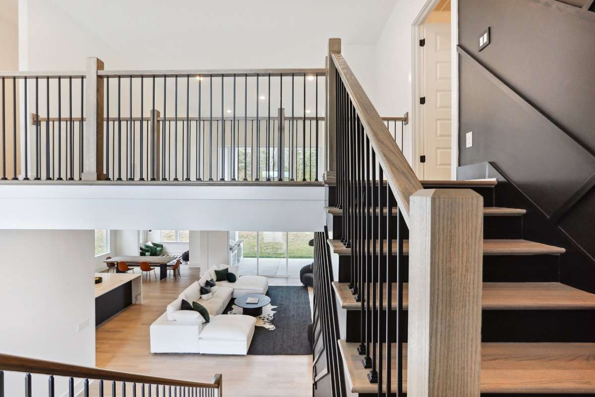 Floating stair concept with 20 ft soaring ceilings