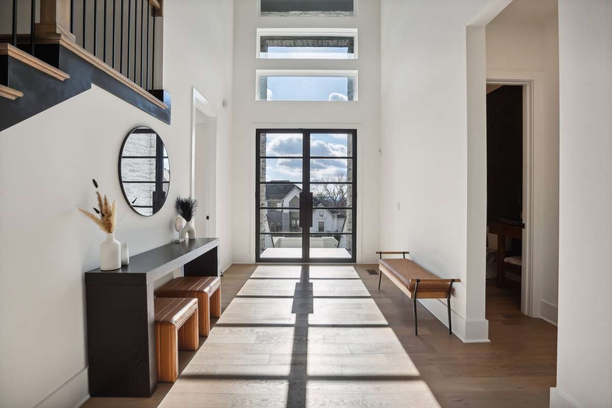 Huge foyer with 20 ft ceilings radiant with natural light!