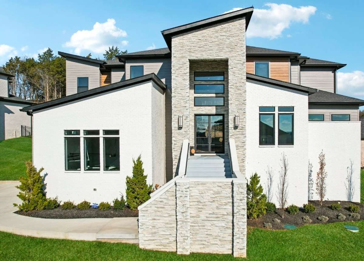 5 BR -6 Bath custom Luxury PIB newer construction home on premium semi-private over a half an acre homesite that backs up to treed deeded common space.