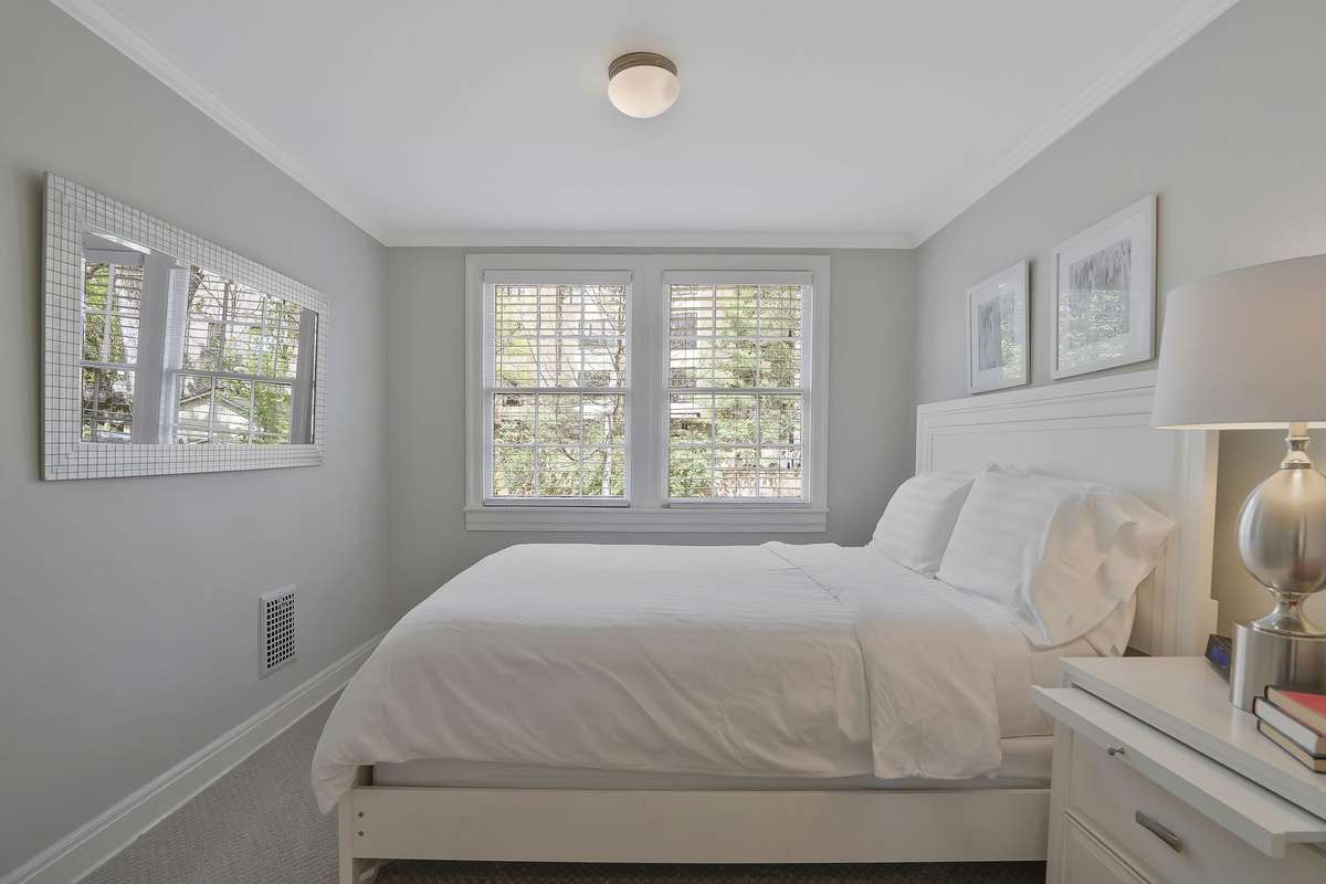 Second level 4th bedroom off the main hallway overlooks the backyard.