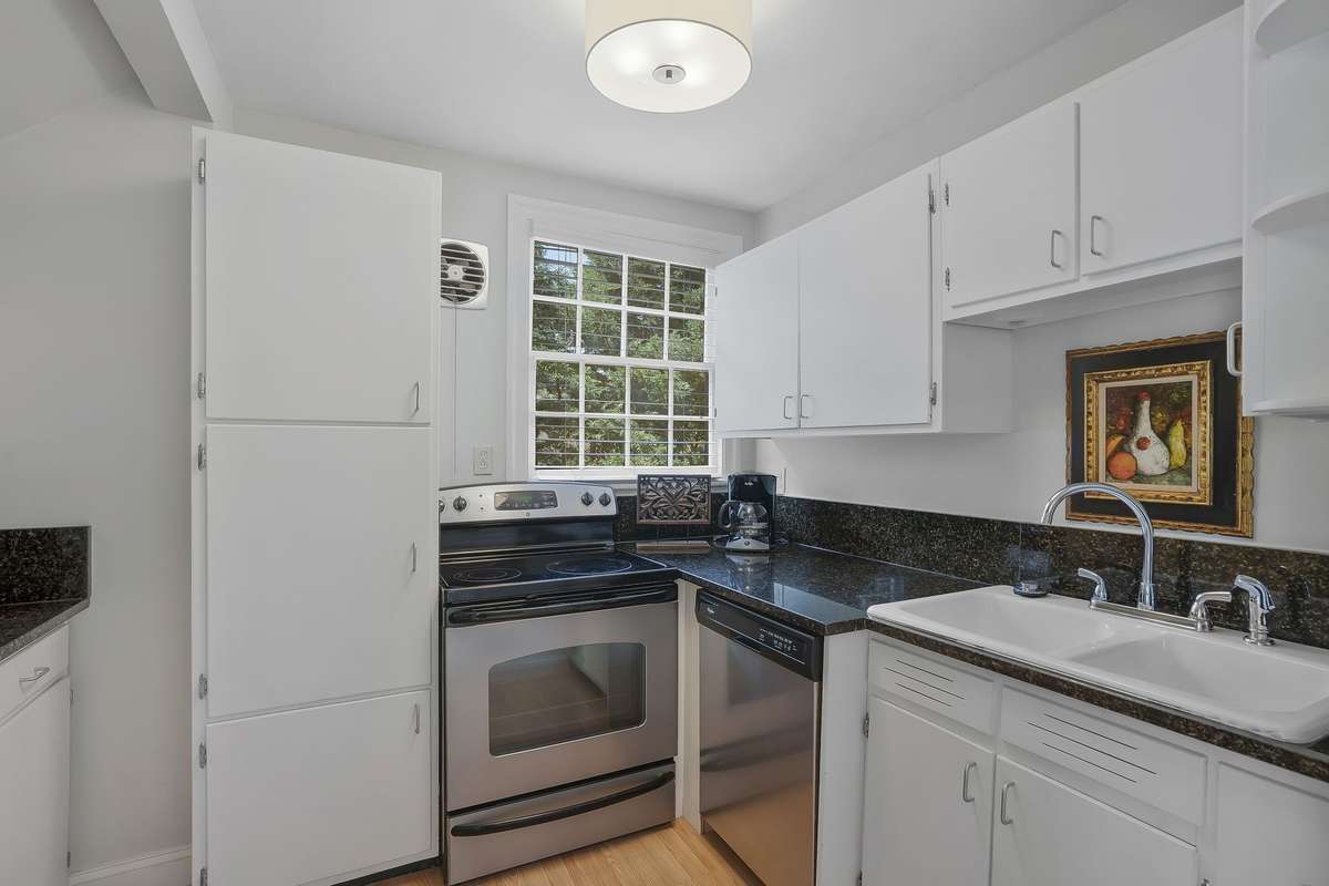 The convenient bonus second-level full kitchen with granite countertops and stainless steel appliances.