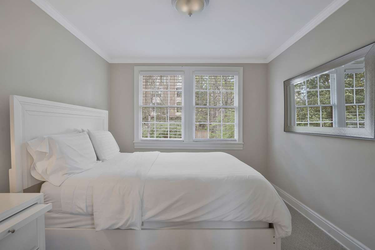 The 5th bedroom overlooks the backyard and is part of the 2nd Level 2 Room Suite!