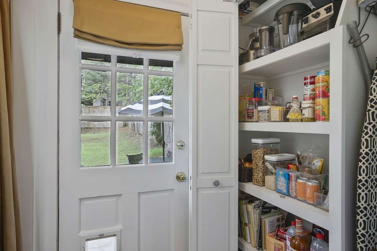 Custom Pantry across from the Laundry Area.