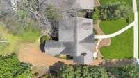 Aerial view of part of the property and the existing home.