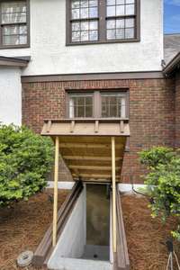 Custom-built outdoor Stairwell Cover, easy to open and close.